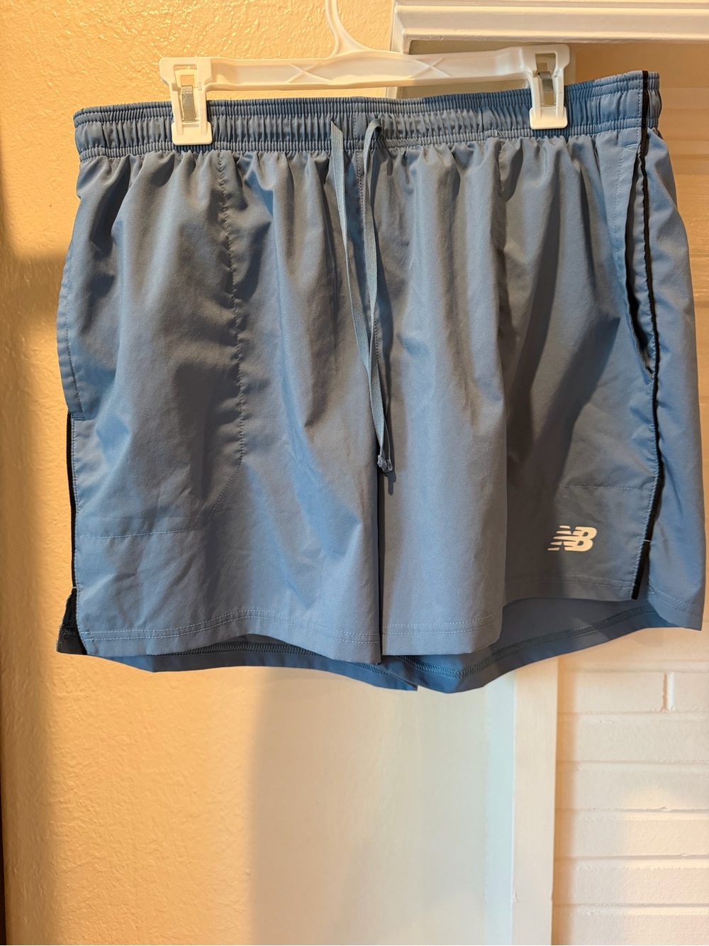 New Balance Woman Light Blue Athletic Running Shorts with Black Trim Breathable